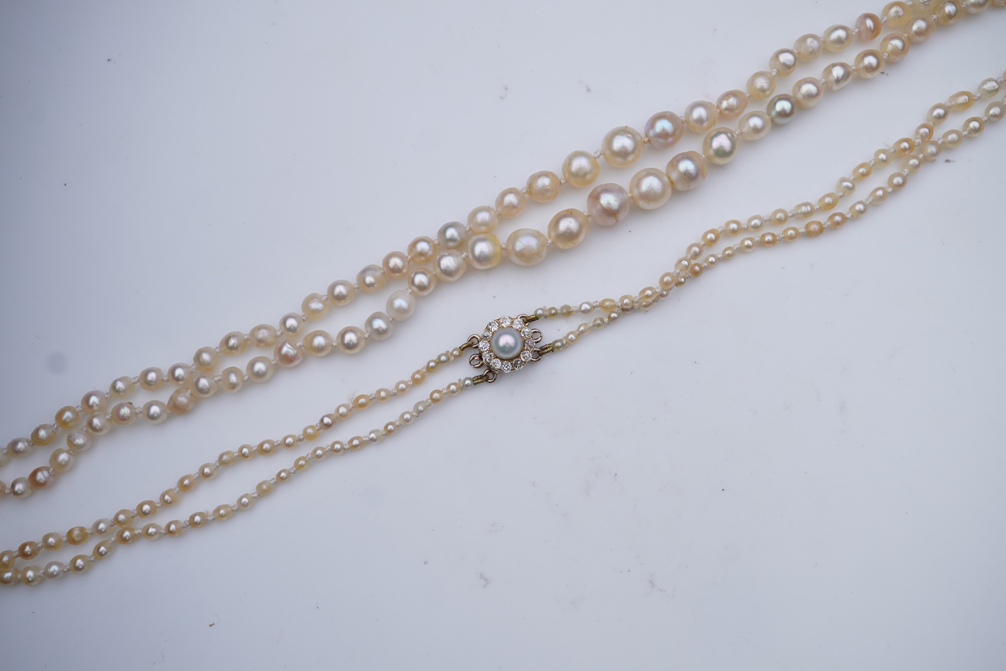 A natural pearl and diamond necklace, early 20th century